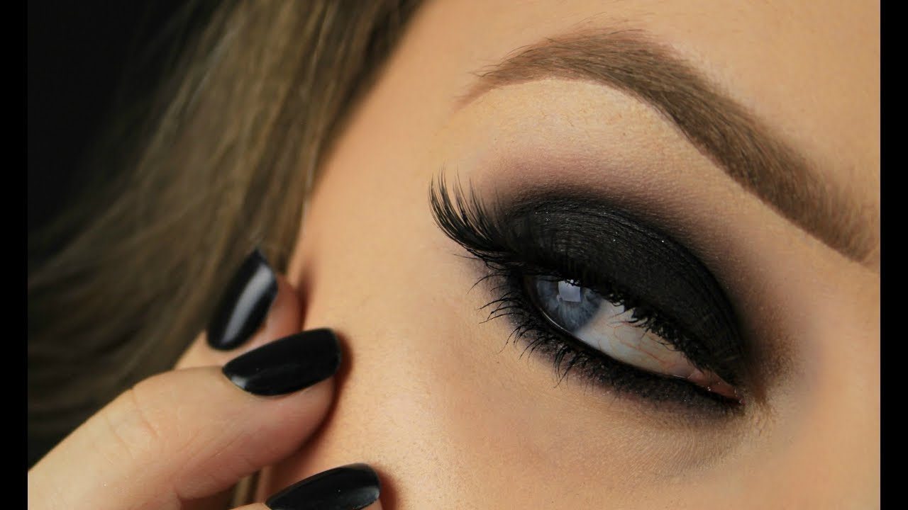 A close-up of a smokey eye finished with a bold black Coogie wing.